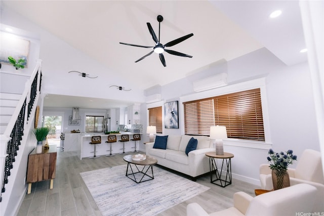 92-1310 Palahia St, Kapolei, HI 96707 - living area featuring a wall mounted AC, stairs, a ceiling fan, light wood-style flooring, and recessed lighting