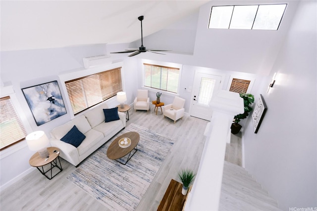 92-1310 Palahia St, Kapolei, HI 96707 - living room with wood finished floors, high vaulted ceiling, ceiling fan, and baseboards
