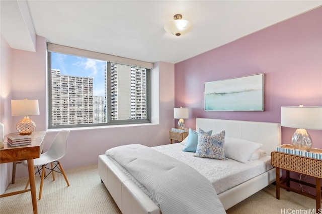 bedroom featuring light carpet