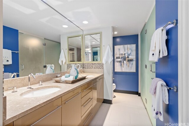 bathroom featuring tile patterned flooring, vanity, and toilet