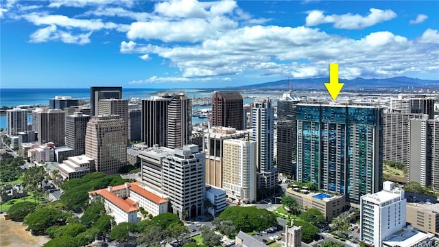 property's view of city with a water and mountain view