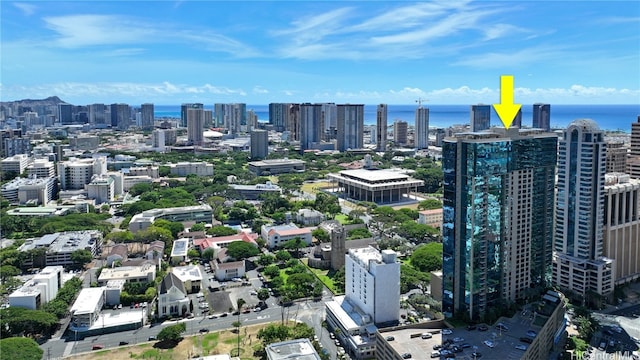 birds eye view of property with a water view