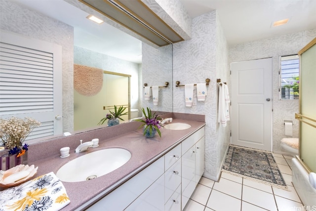 bathroom with tile patterned floors and vanity