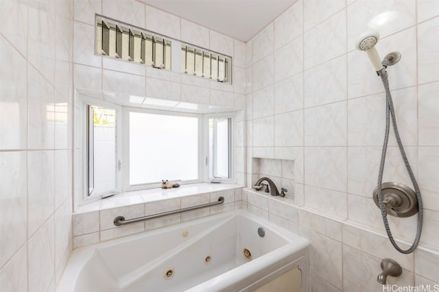 bathroom with a bath and tile walls