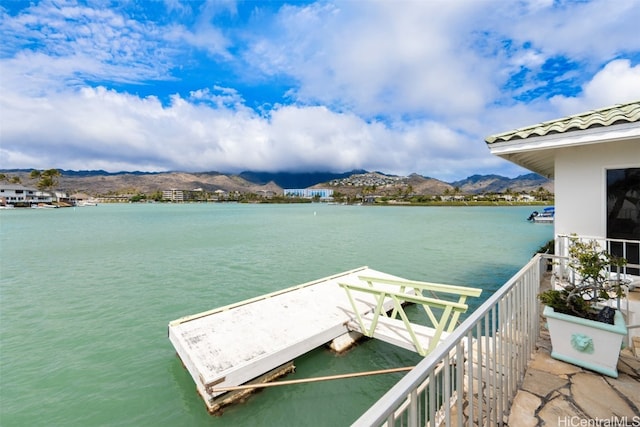 dock area with a water and mountain view