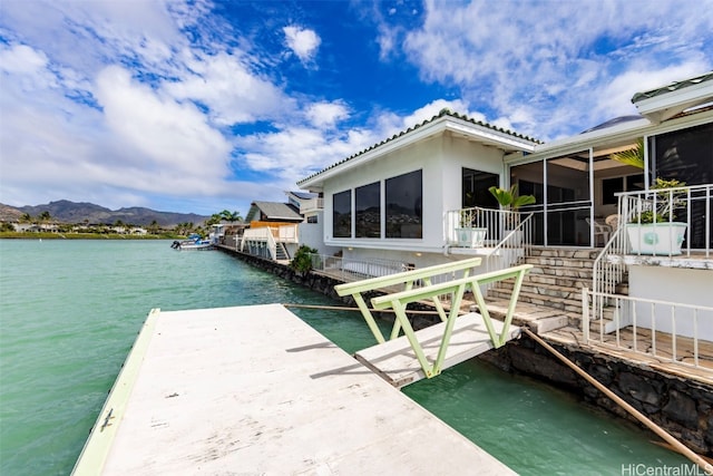 dock area with a water and mountain view