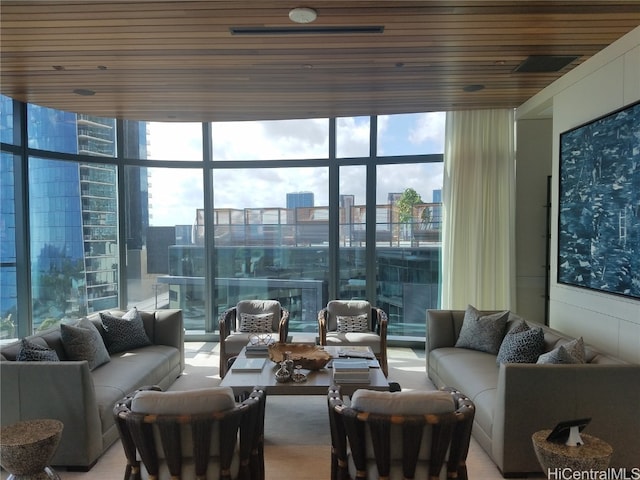 living room with floor to ceiling windows, wooden ceiling, and plenty of natural light