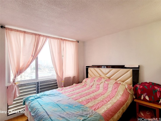 bedroom featuring a textured ceiling