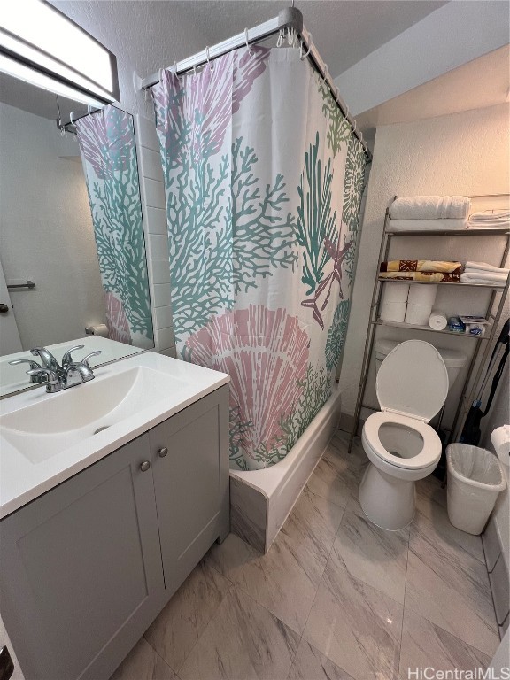 full bathroom with vanity, toilet, and shower / tub combo with curtain