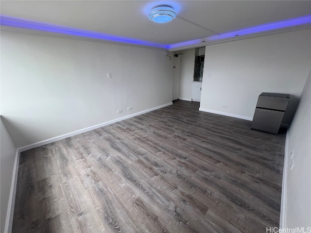 empty room with dark hardwood / wood-style floors