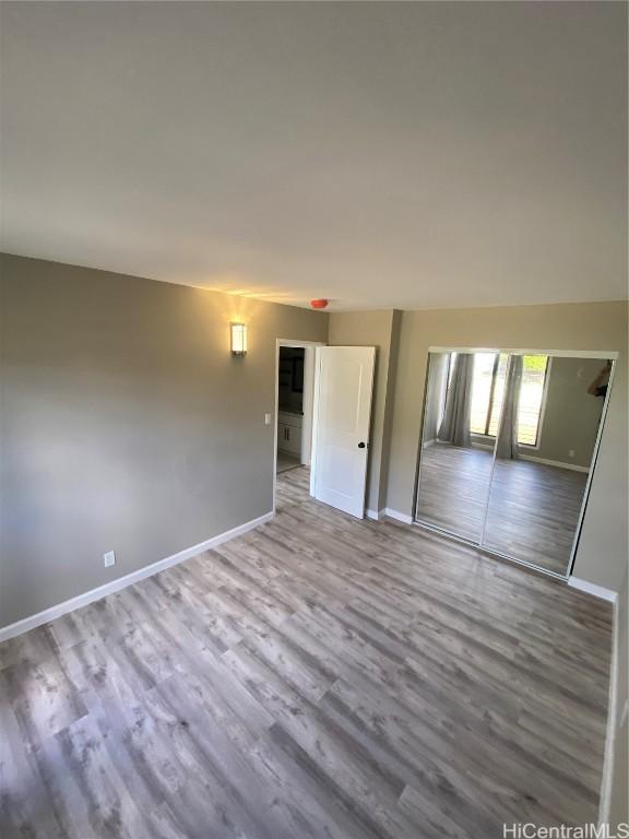 unfurnished room with light wood-type flooring