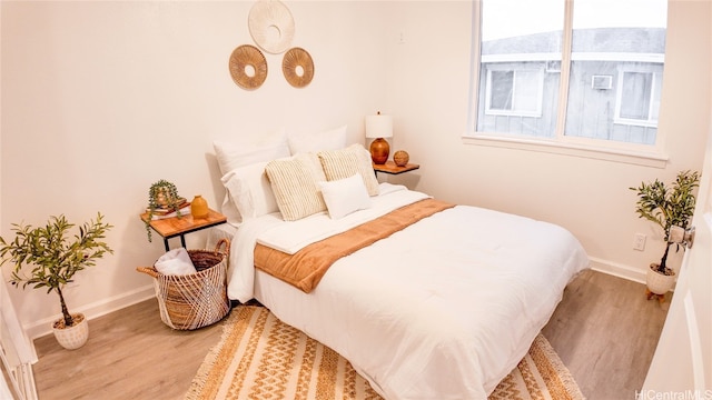 bedroom featuring hardwood / wood-style floors