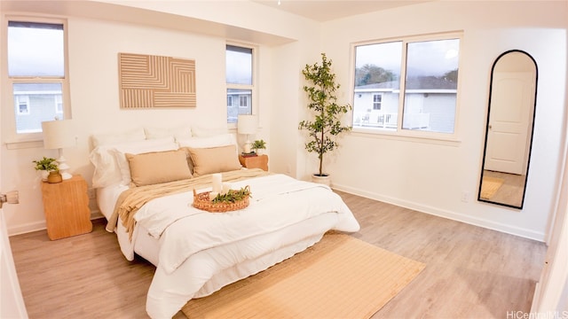 bedroom with light hardwood / wood-style flooring