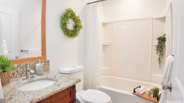 full bathroom featuring shower / bath combo, vanity, and toilet