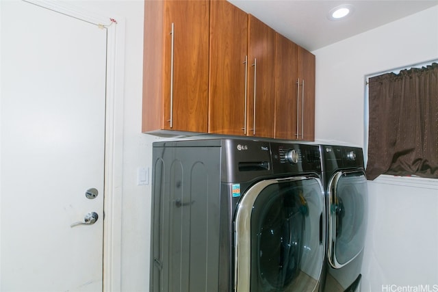 laundry area featuring cabinets and independent washer and dryer