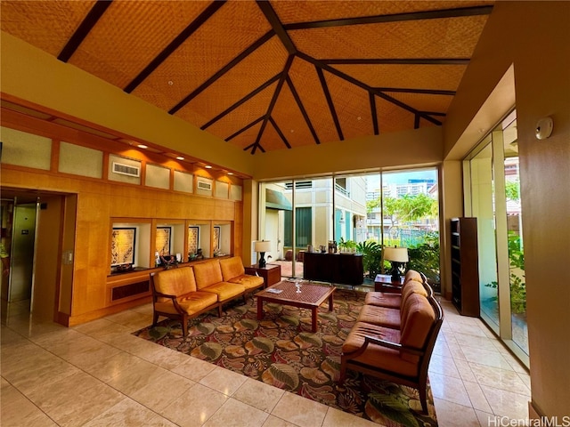 sunroom / solarium featuring lofted ceiling with beams