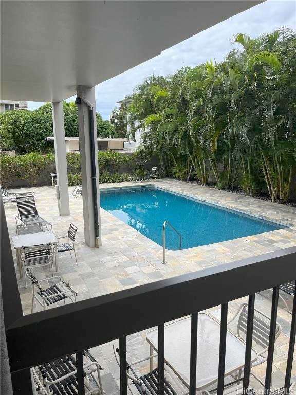 view of pool featuring a patio area