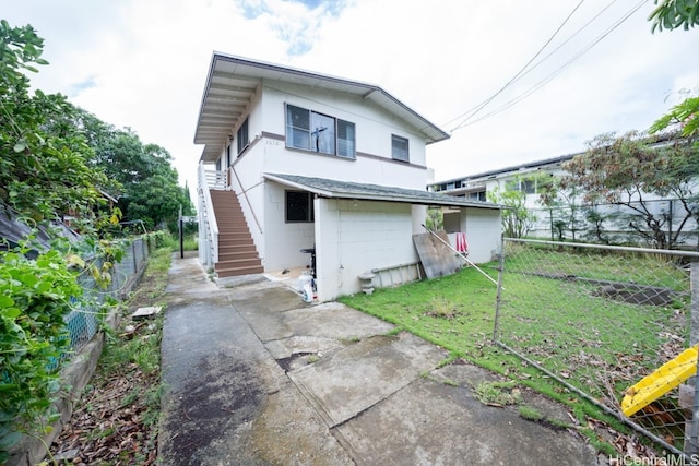 rear view of house with a lawn