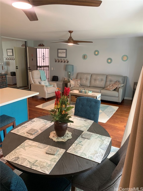 dining space featuring hardwood / wood-style floors and ceiling fan