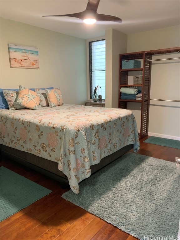 bedroom featuring wood-type flooring and ceiling fan