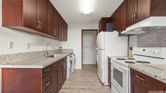 kitchen featuring light stone countertops, electric range, sink, light hardwood / wood-style floors, and a textured ceiling