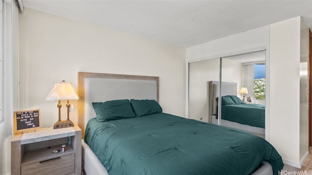 bedroom featuring a closet and a textured ceiling