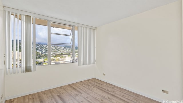 empty room with wood-type flooring