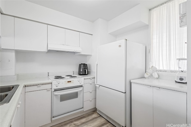 kitchen with white cabinetry, light wood-type flooring, and white appliances