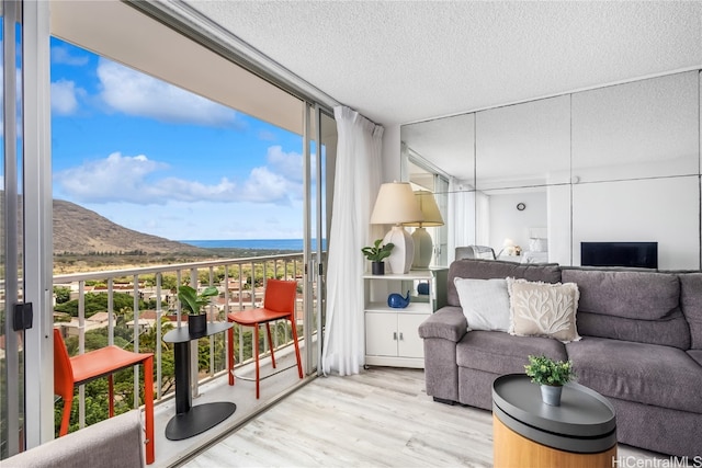 sunroom featuring a mountain view