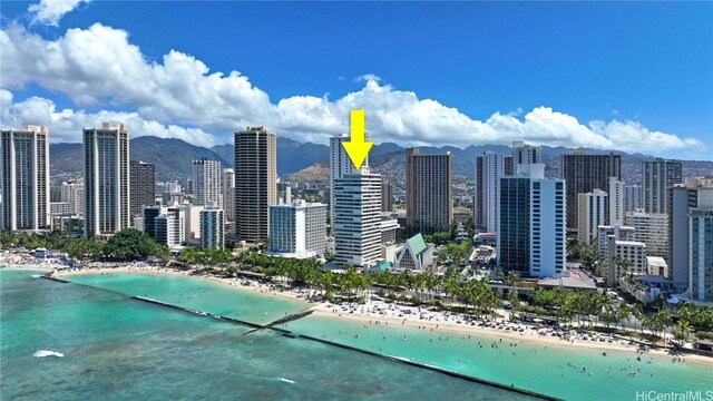 view of city with a water view and a beach view