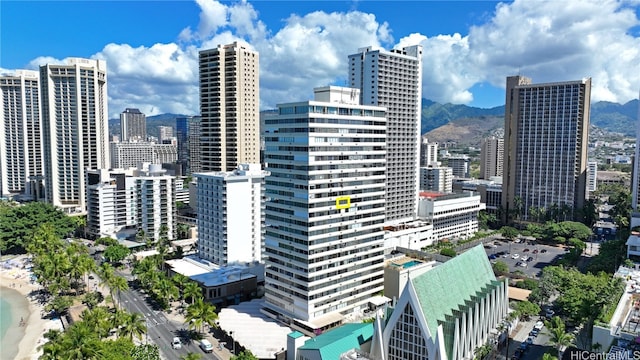 property's view of city with a mountain view