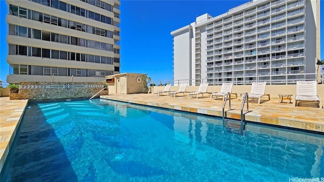 pool featuring a patio area