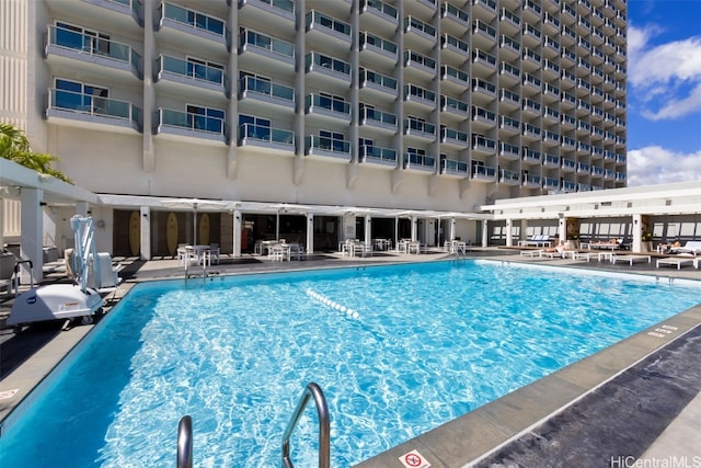 view of swimming pool with a patio