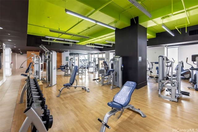 workout area with light wood-type flooring