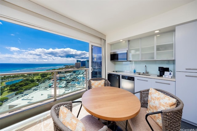 410 Atkinson Dr Unit 3007, Honolulu, HI 96814 - kitchen with a sink, a water view, light countertops, glass insert cabinets, and appliances with stainless steel finishes