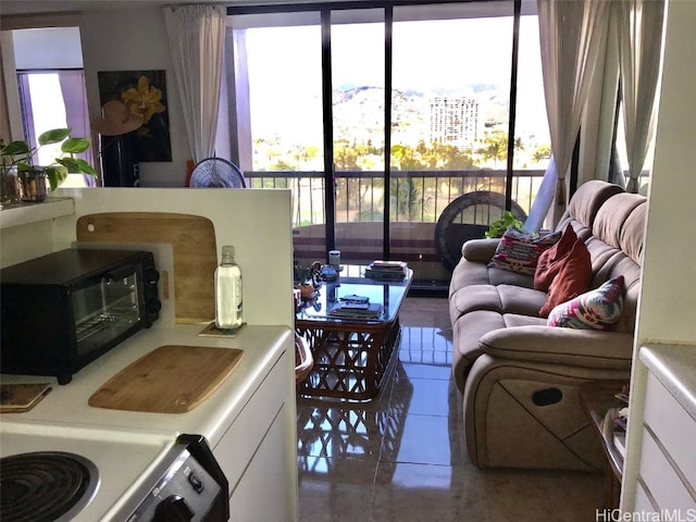 tiled living room with a healthy amount of sunlight