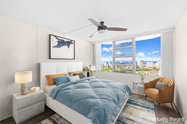 bedroom featuring hardwood / wood-style flooring and ceiling fan