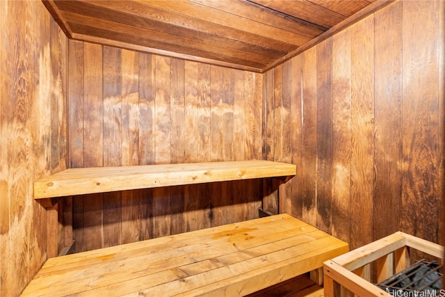 view of sauna / steam room with wooden walls and wooden ceiling