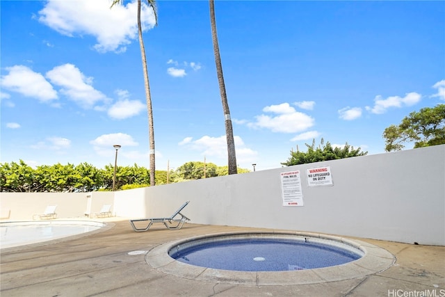 view of pool featuring a community hot tub