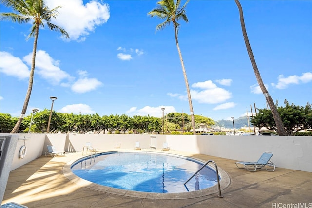 view of swimming pool featuring a patio area