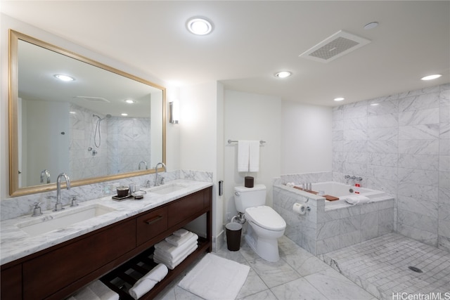 full bathroom with vanity, shower with separate bathtub, and toilet