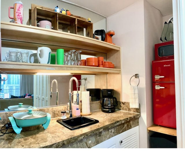 440 Olohana St Unit 1808, Honolulu, HI 96815 - kitchen with a sink, white cabinetry, and open shelves