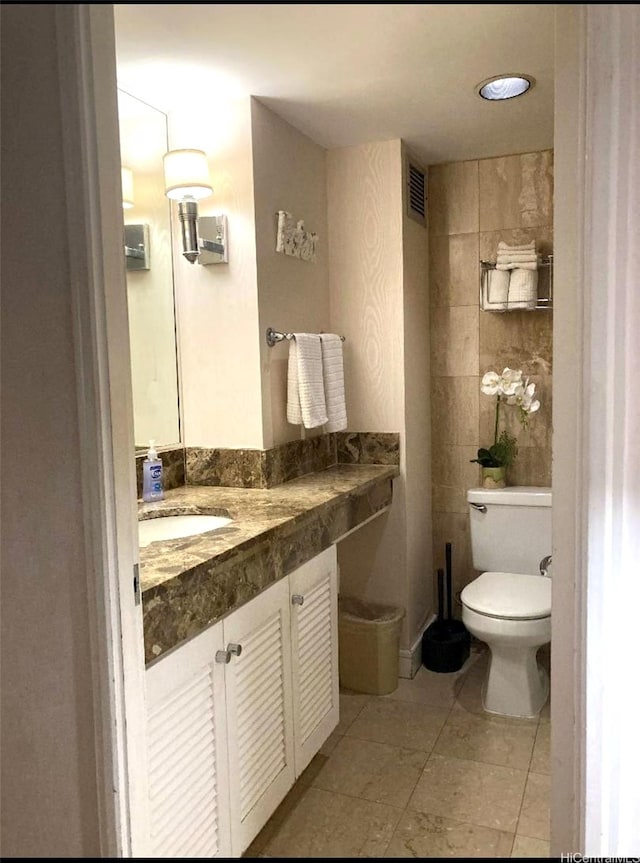 440 Olohana St Unit 1808, Honolulu, HI 96815 - bathroom with toilet, vanity, and tile patterned flooring