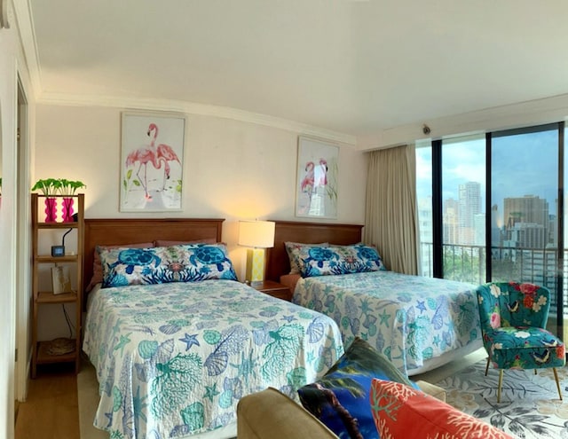 440 Olohana St Unit 1808, Honolulu, HI 96815 - bedroom with wood finished floors, crown molding, access to exterior, and a city view