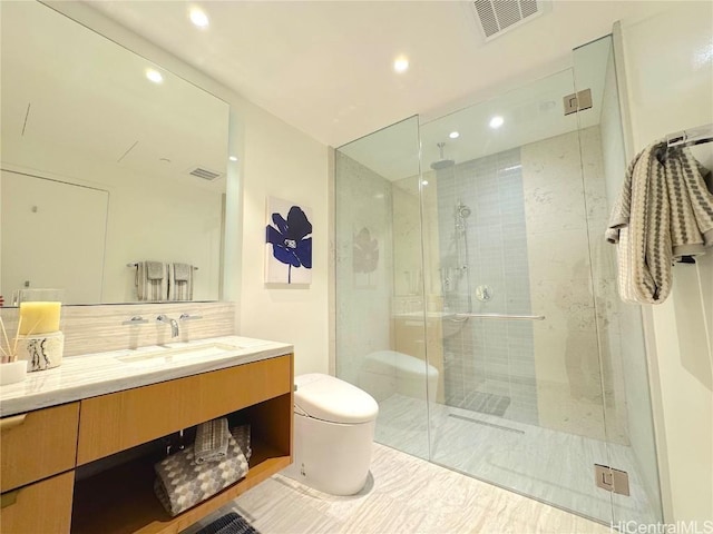 bathroom with decorative backsplash, vanity, toilet, and walk in shower