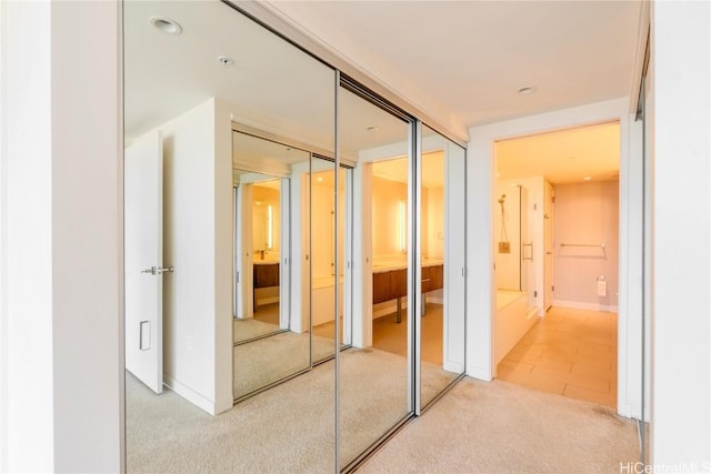 corridor with light colored carpet