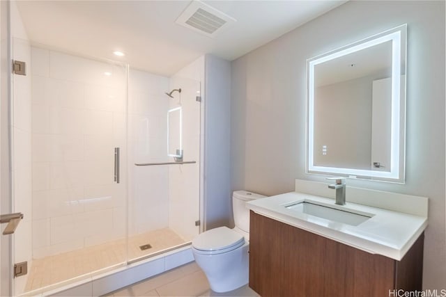 bathroom with vanity, an enclosed shower, tile patterned flooring, and toilet