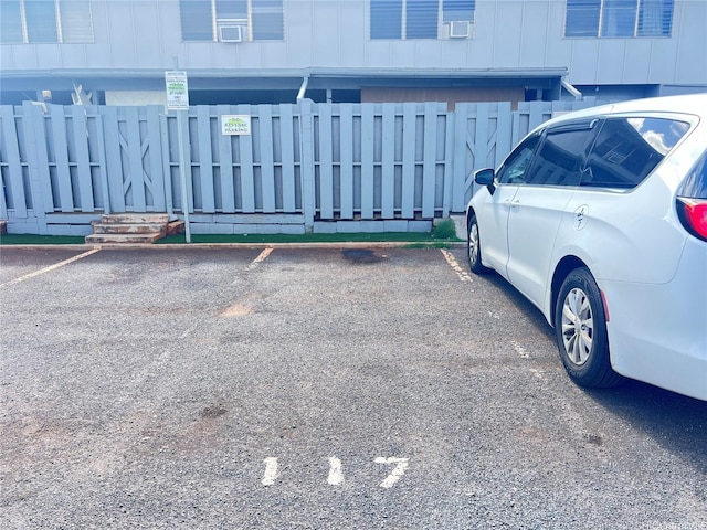 91-593 Kuilioloa Pl Unit Y2, Ewa Beach, HI 96706 - uncovered parking lot with a fenced front yard