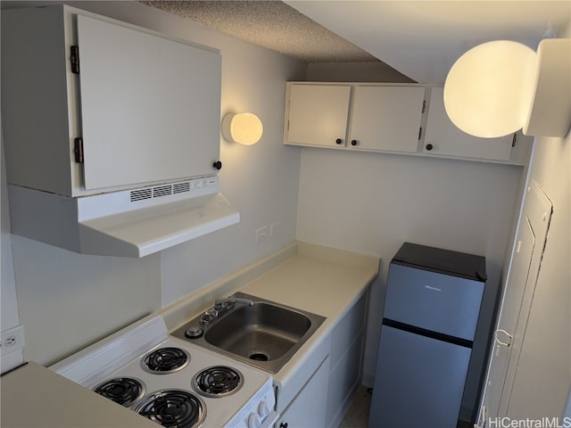 kitchen featuring white electric stove, white cabinetry, and a textured ceiling