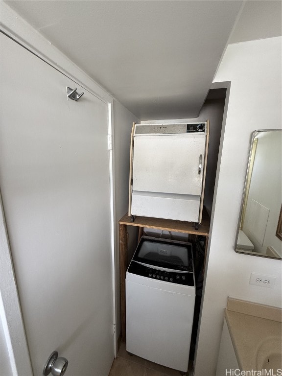 interior space featuring vanity and washer / clothes dryer